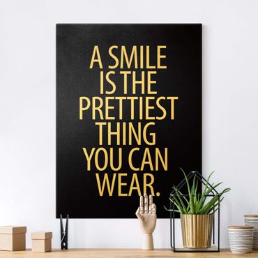 Quadro su tela oro - A Smile is the prettiest thing Sans Serif nero