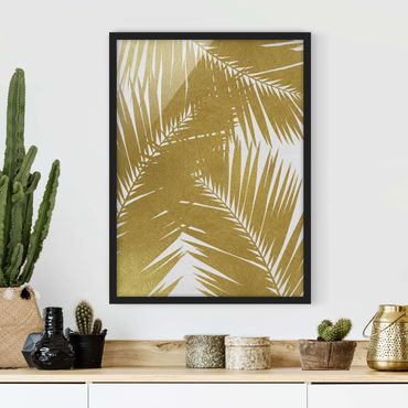 Poster con cornice - Scorcio tra foglie di palme dorate