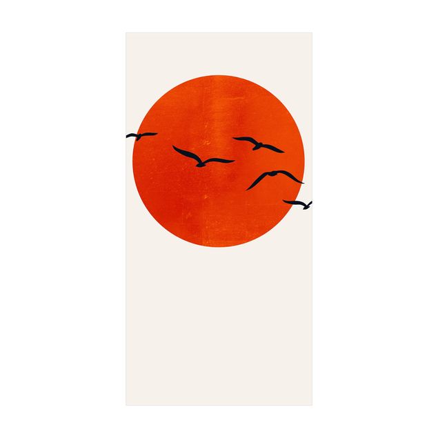 Tappeti con motivi naturali Stormo di uccelli di fronte al sole rosso I