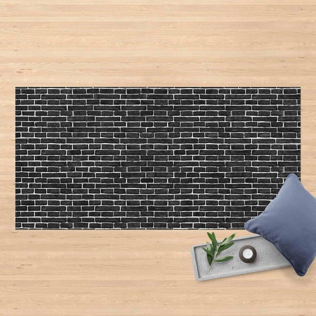 tappeto terrazzo Muro di mattoni nero