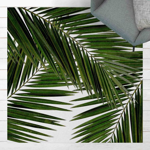 tappeto terrazzo Vista attraverso le foglie di palma verde