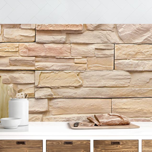 rivestimenti cucina effetto marmo Muro di pietra asiatico alto e luminoso fatto di pietre