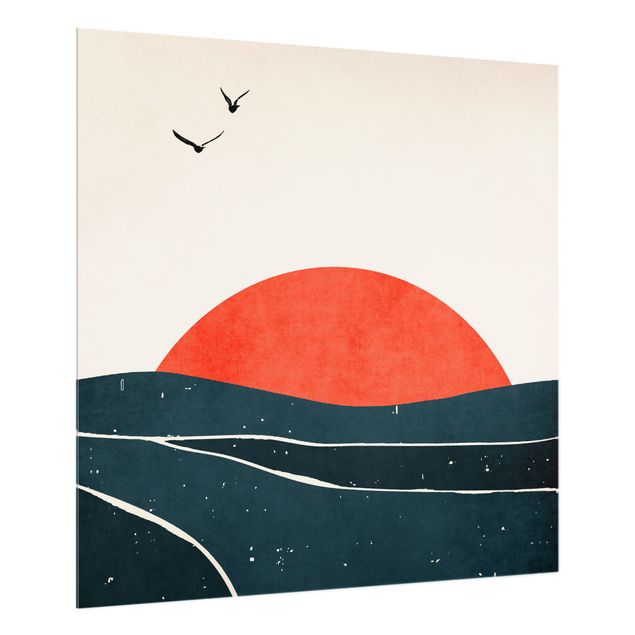 Paraschizzi con paesaggio Oceano di fronte al sole rosso