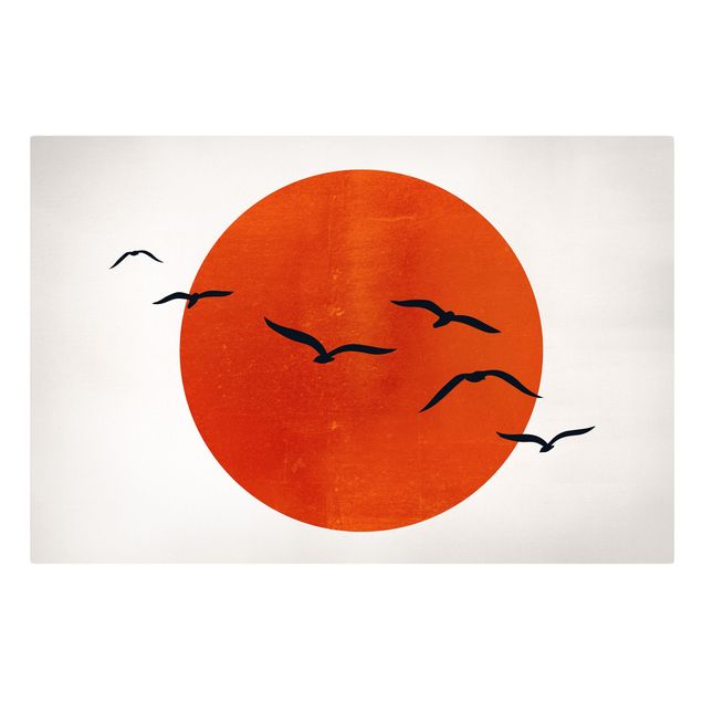 Quadri su tela paesaggio Stormo di uccelli di fronte al sole rosso I