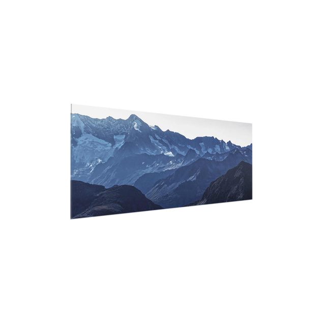 Quadri in vetro con paesaggio Vista panoramica delle montagne blu