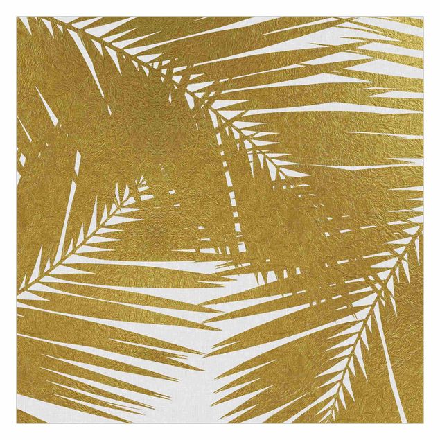 Carte da parati oro Vista attraverso le foglie di palma dorate