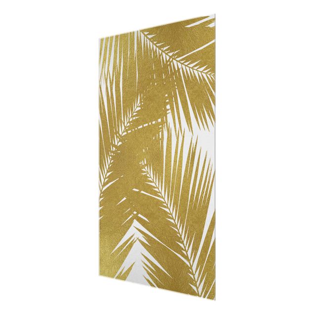Magnettafel Glas Vista attraverso le foglie di palma dorate
