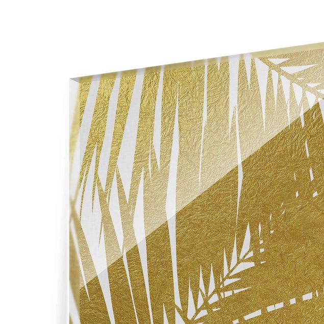 Quadro in vetro - Scorcio tra foglie di palme dorate