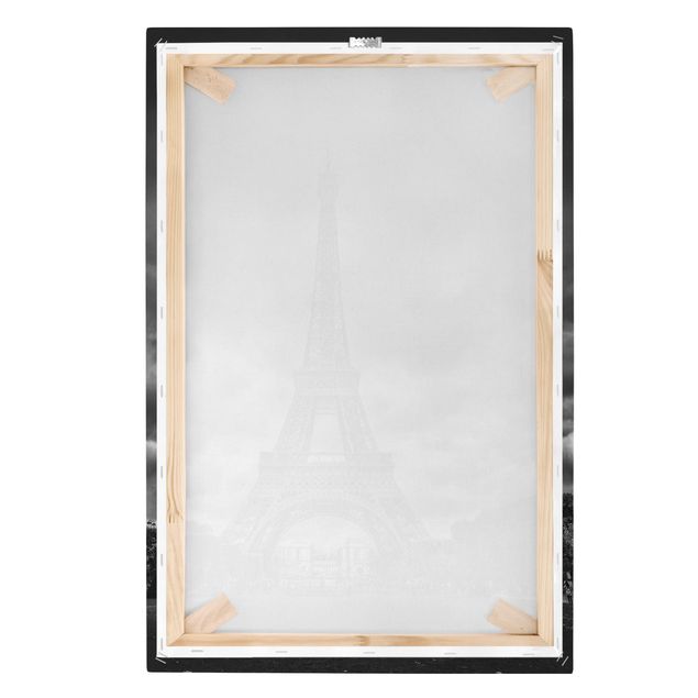 Stampe su tela Torre Eiffel davanti alle nuvole in bianco e nero