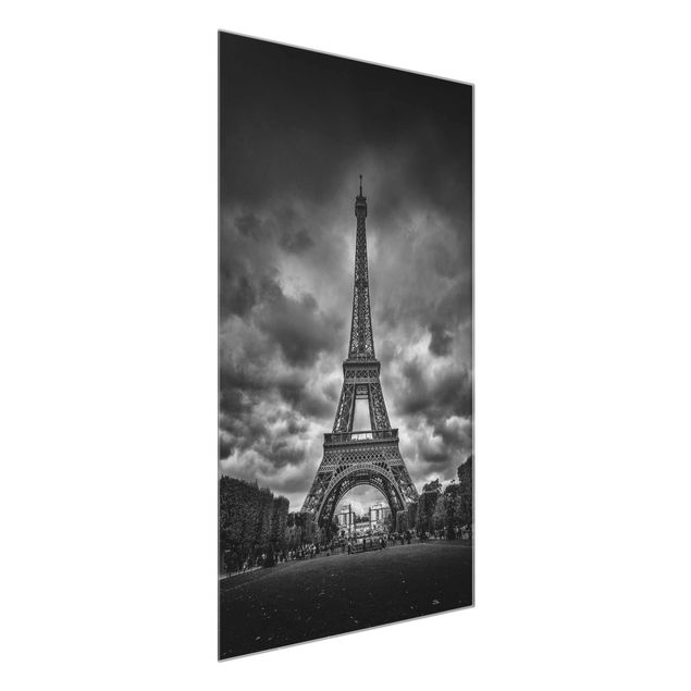 Quadri in vetro in bianco e nero Torre Eiffel davanti alle nuvole in bianco e nero