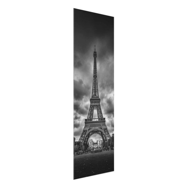 Quadri in vetro in bianco e nero Torre Eiffel davanti alle nuvole in bianco e nero
