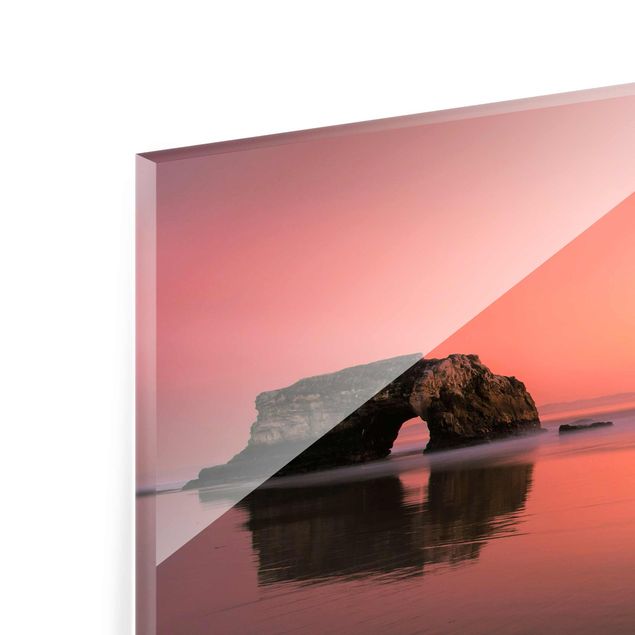Quadri in vetro con paesaggio Ponte naturale al tramonto