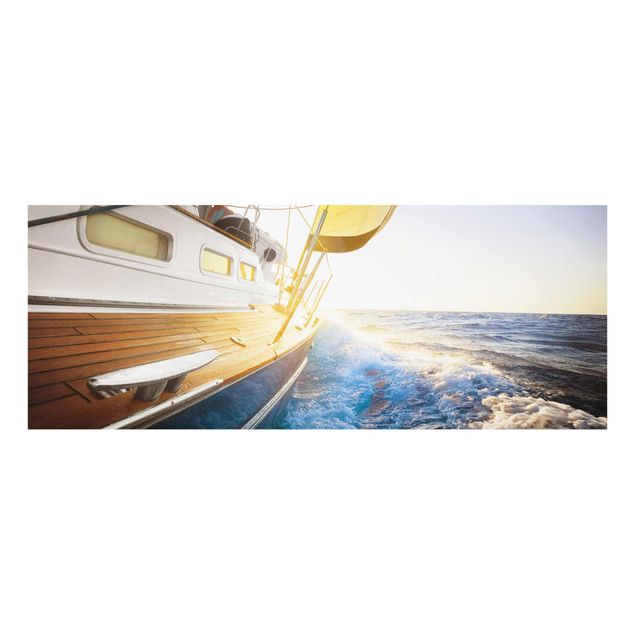 Quadri in vetro con paesaggio Barca a vela sull'oceano blu in pieno sole