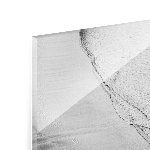 Quadri in vetro con paesaggio Onde morbide sulla spiaggia in bianco e nero