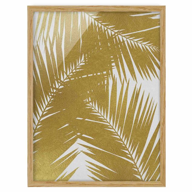 Quadro floreale Vista attraverso le foglie di palma dorate