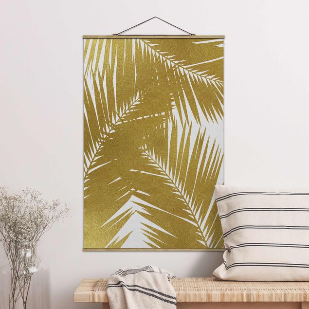 Quadro paesaggio Vista attraverso le foglie di palma dorate