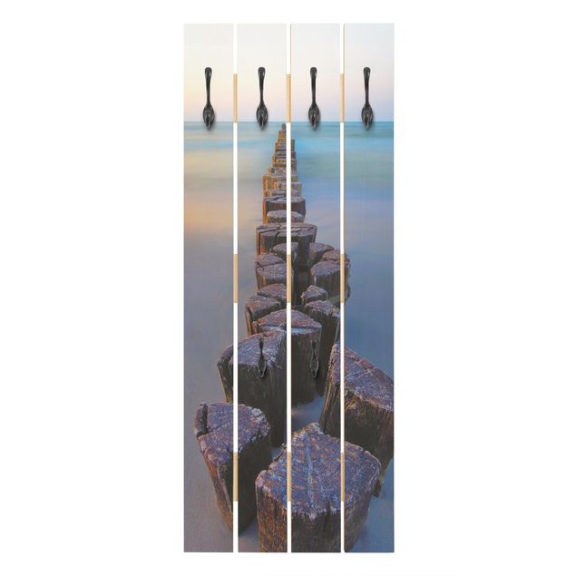 Appendiabiti pannello effetto legno Groynes al tramonto sull'oceano