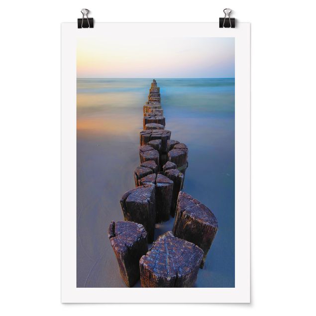 Poster con spiaggia Groynes al tramonto sull'oceano