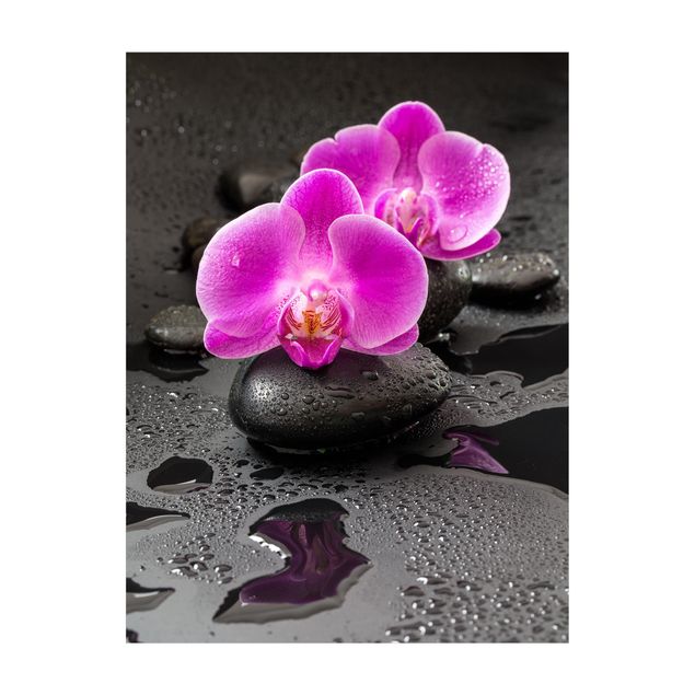 tappeto rosa antico Fiore di orchidea rosa su pietra con gocce