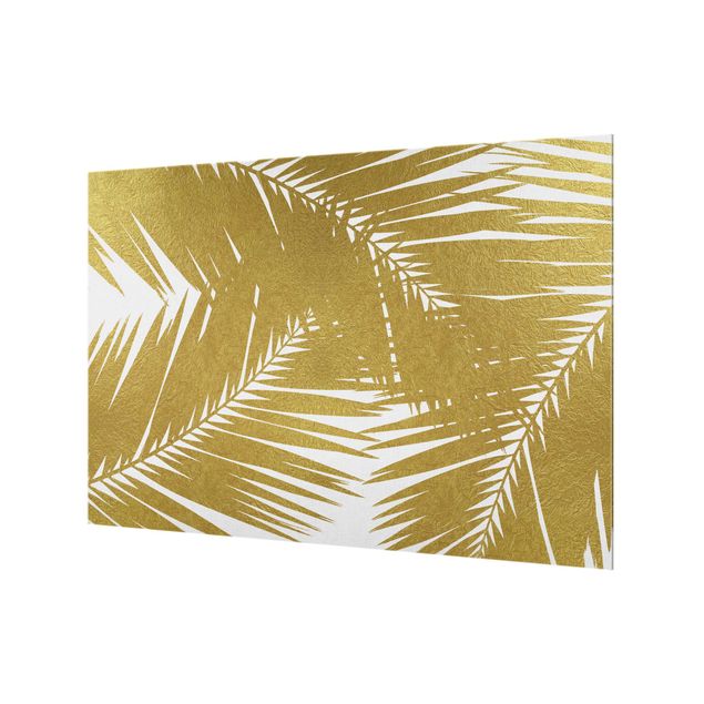 Paraspruzzi cucina Vista attraverso le foglie di palma dorate