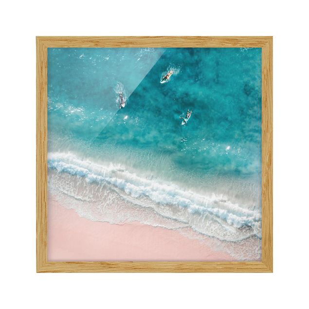 Quadri con spiaggia e mare Tre surfisti che pagaiano verso la riva