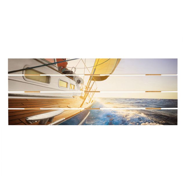 Quadri in legno Barca a vela sull'oceano blu in pieno sole