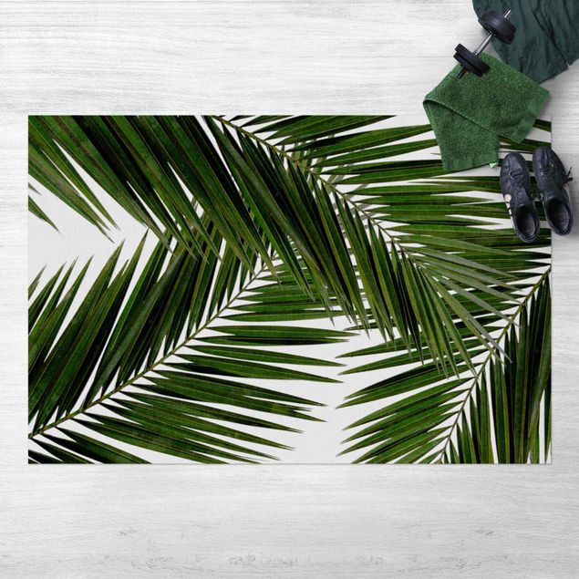 tappeto per terrazzo esterno Vista attraverso le foglie di palma verde