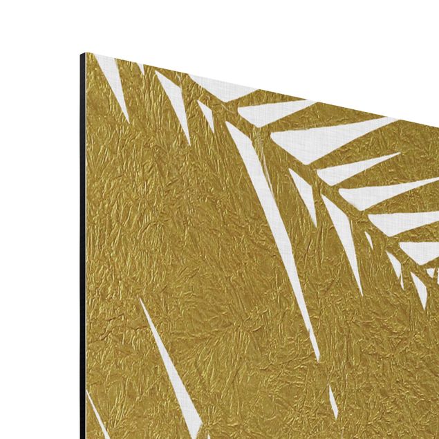 Quadri stampe Vista attraverso le foglie di palma dorate