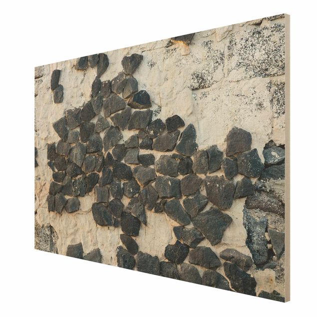 Quadri su legno Muro con pietre nere