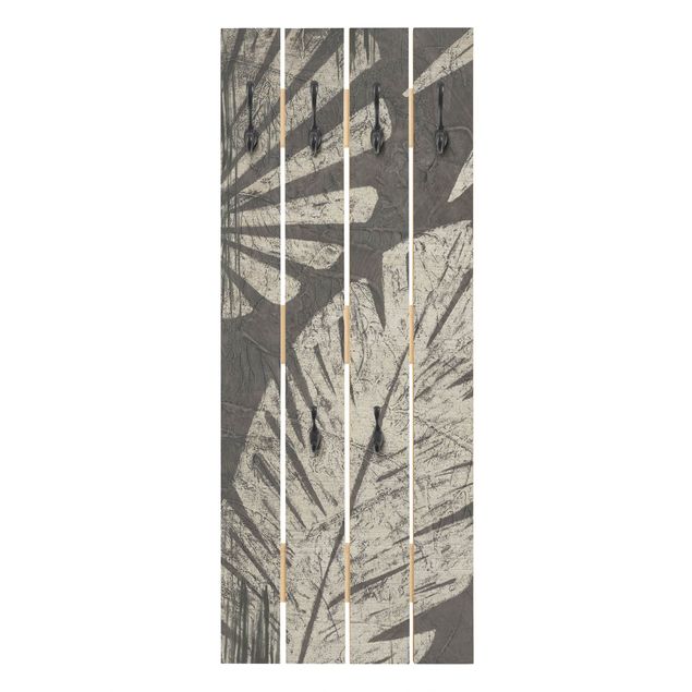 Attaccapanni grigio Sfondo grigio scuro con foglie di palma